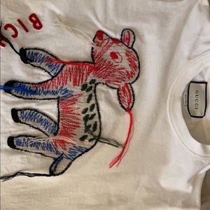 Gucci women shirt size medium been worn by my daughter it has a little stain